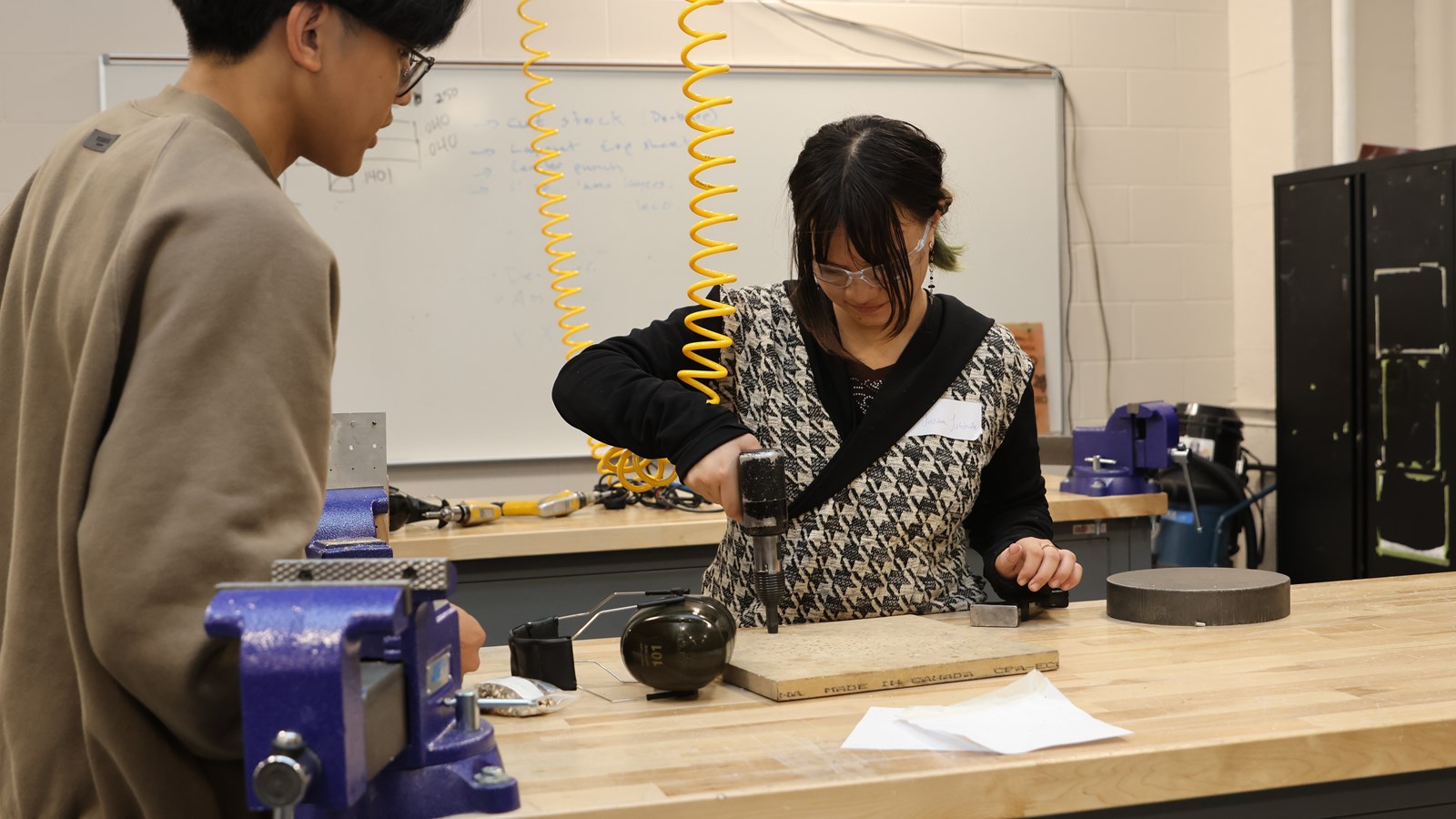 Grade 11 Tec-Voc student Jessilina Jubinville working with all these drills and learning about different tools that are used in Aerospace.