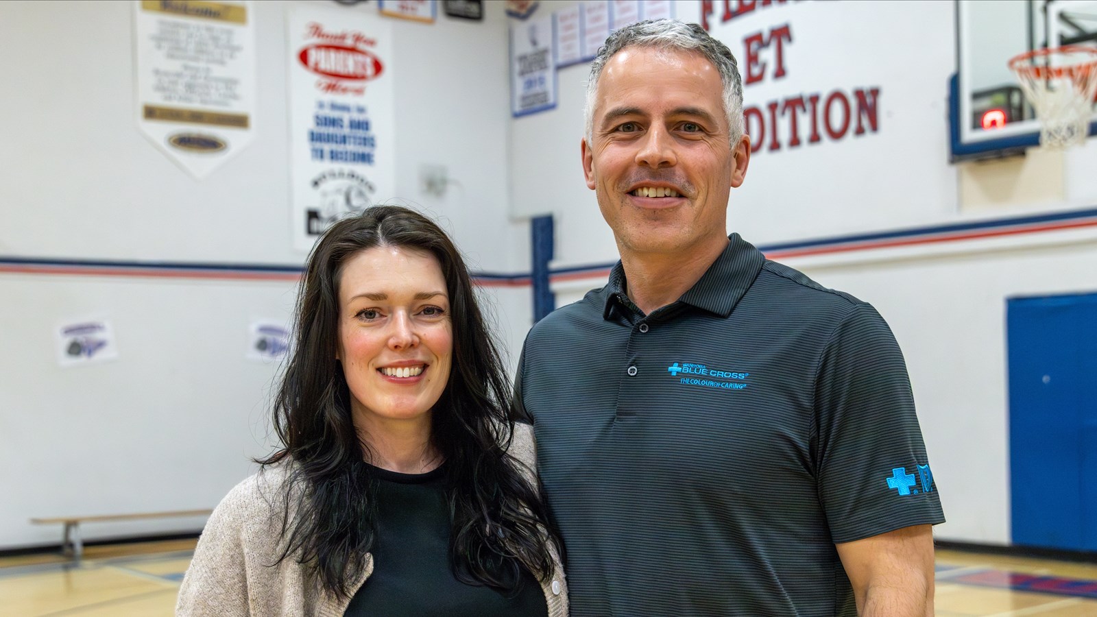 Luke Johnston and Jenna Christoph, volunteers at Churchill High School 