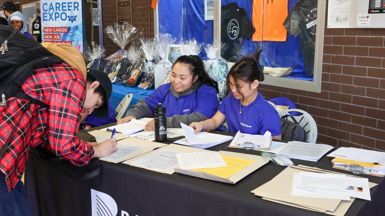 Volunteer students and teachers welcomed students to the Career Expo.