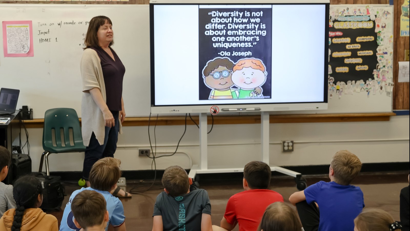 Ms. Rice explaining about Neurodiversity to students at Harrow School.