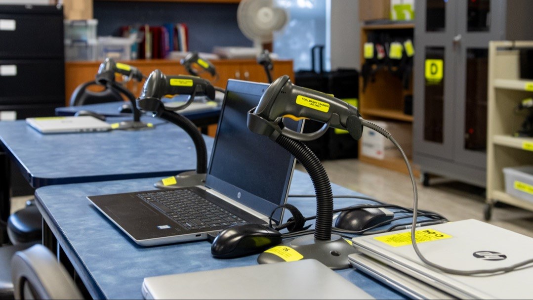 Library technicians in training use specialized equipment and resources to learn how to manage, curated, and catalogue resources.