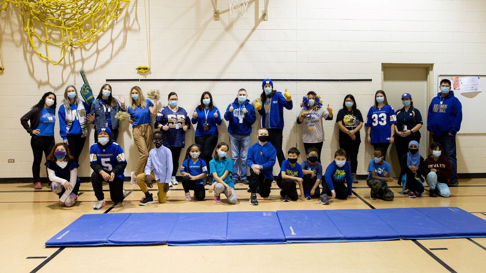 Pinkham School students and staff dressed in blue to support the Winnipeg Blue Bombers in the Grey Cup