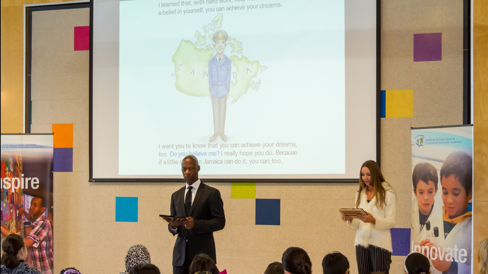 Devon and Pearlene Clunis reading their book "The Little Boy from Jamaica" to WSD Students