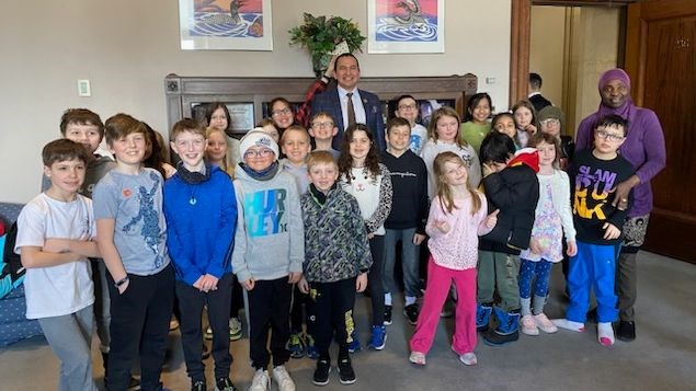 Lord Roberts School students and NDP Leader Wab Kinew