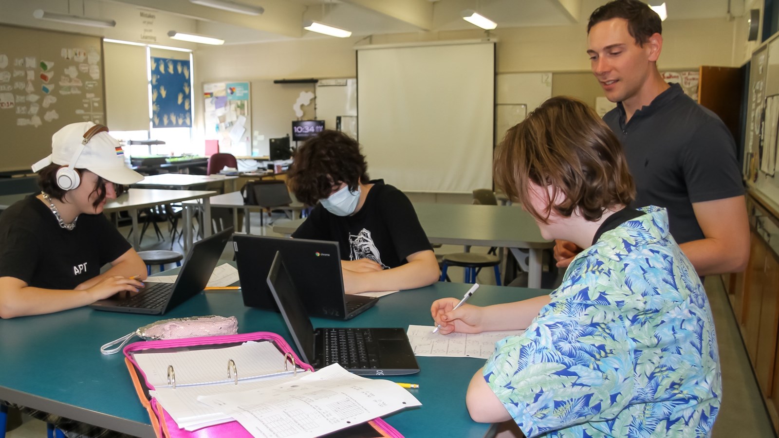 George Pearce, math teacher guiding Grade 7 students at Gordon Bell High School